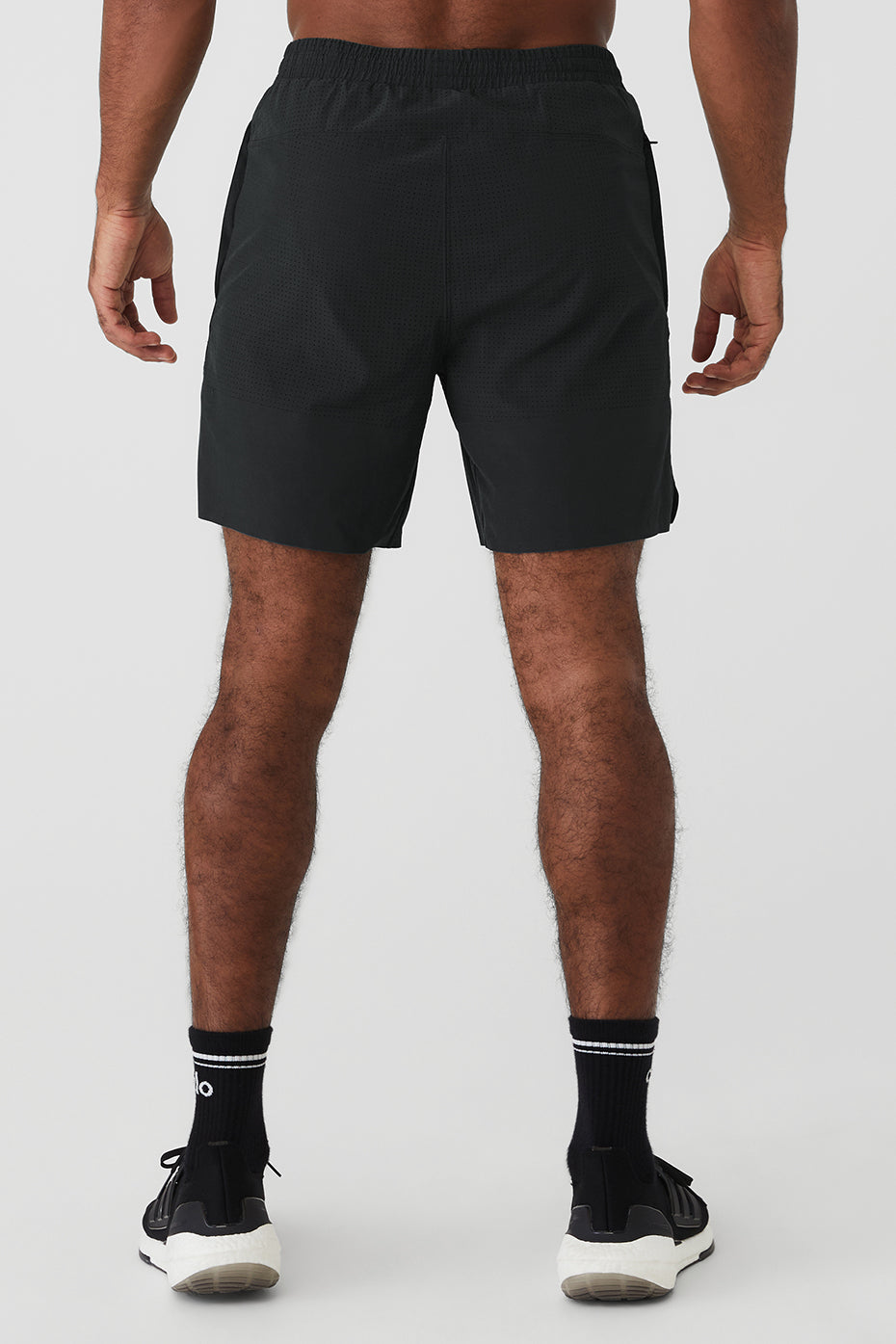 Model wearing black workout shorts during a treadmill session