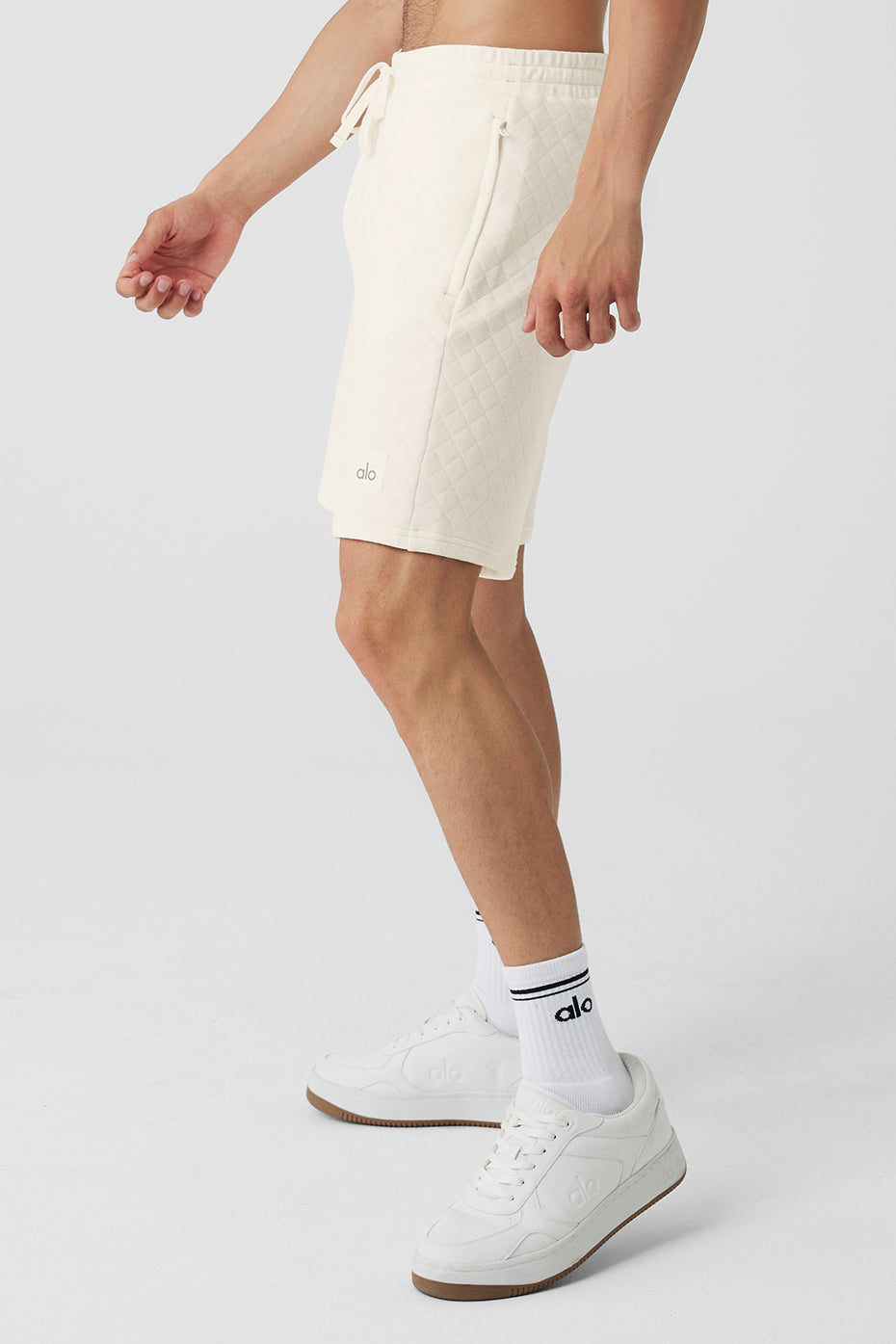 Mens athletic shorts in action during a workout, demonstrating moisture-wicking features.