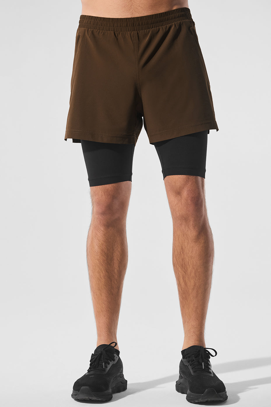 Close-up of the Revival 2-in-1 running shorts showcasing the elastic waistband and inner compression briefs.
