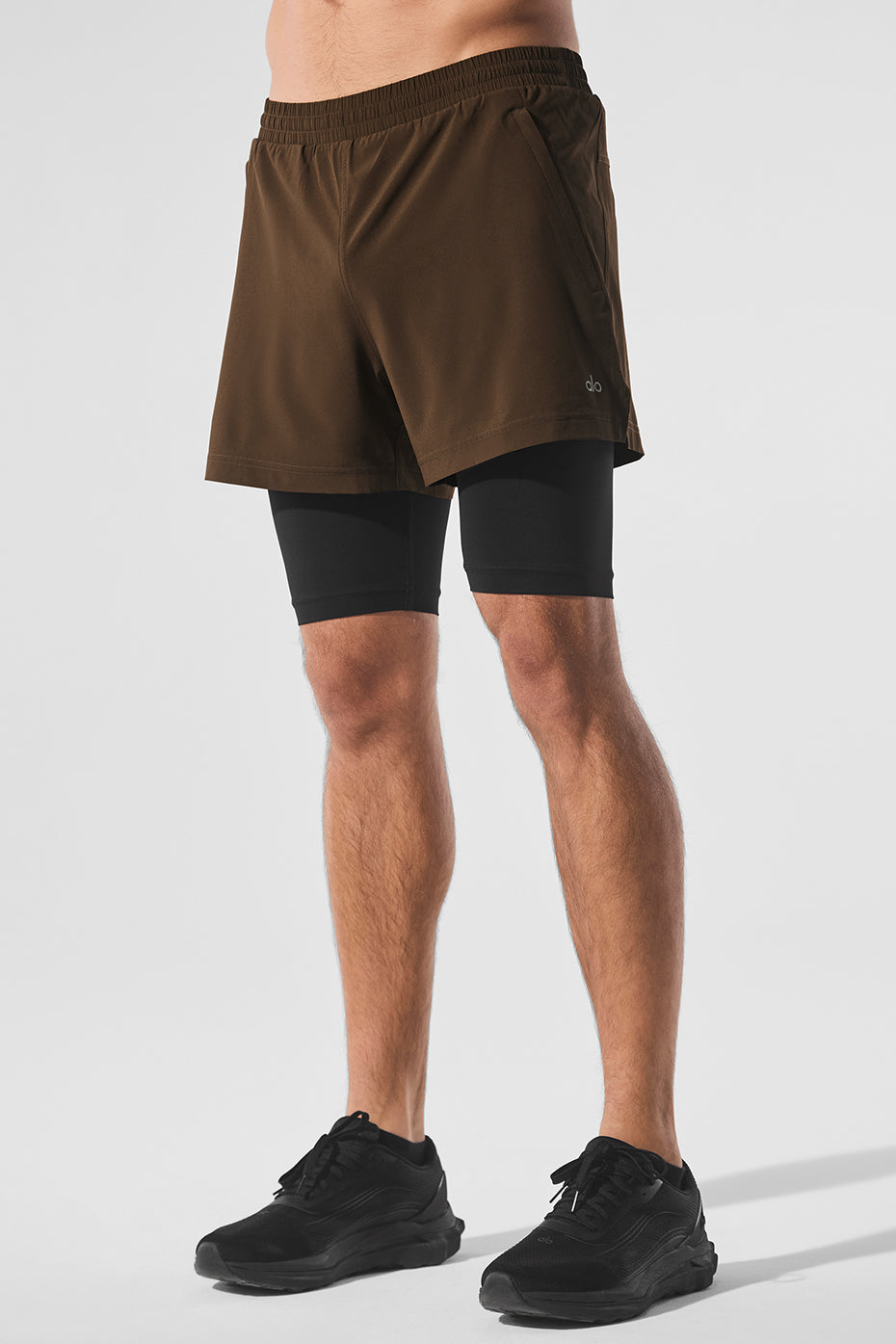 Close-up of the Revival 2-in-1 running shorts showcasing the elastic waistband and inner compression briefs.