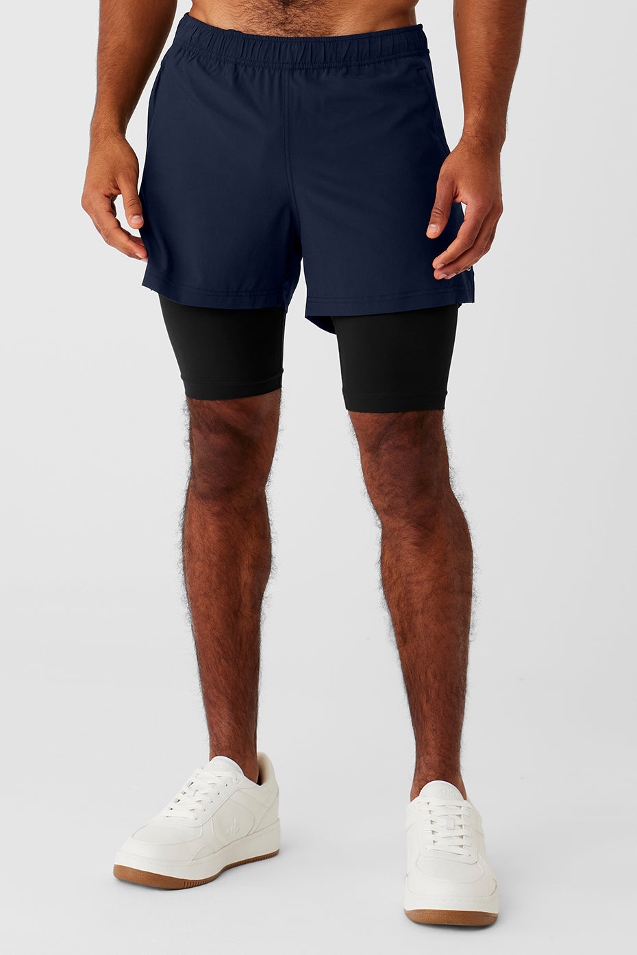 Front view of 2-in-1 shorts showing zip pocket and fitted waistband