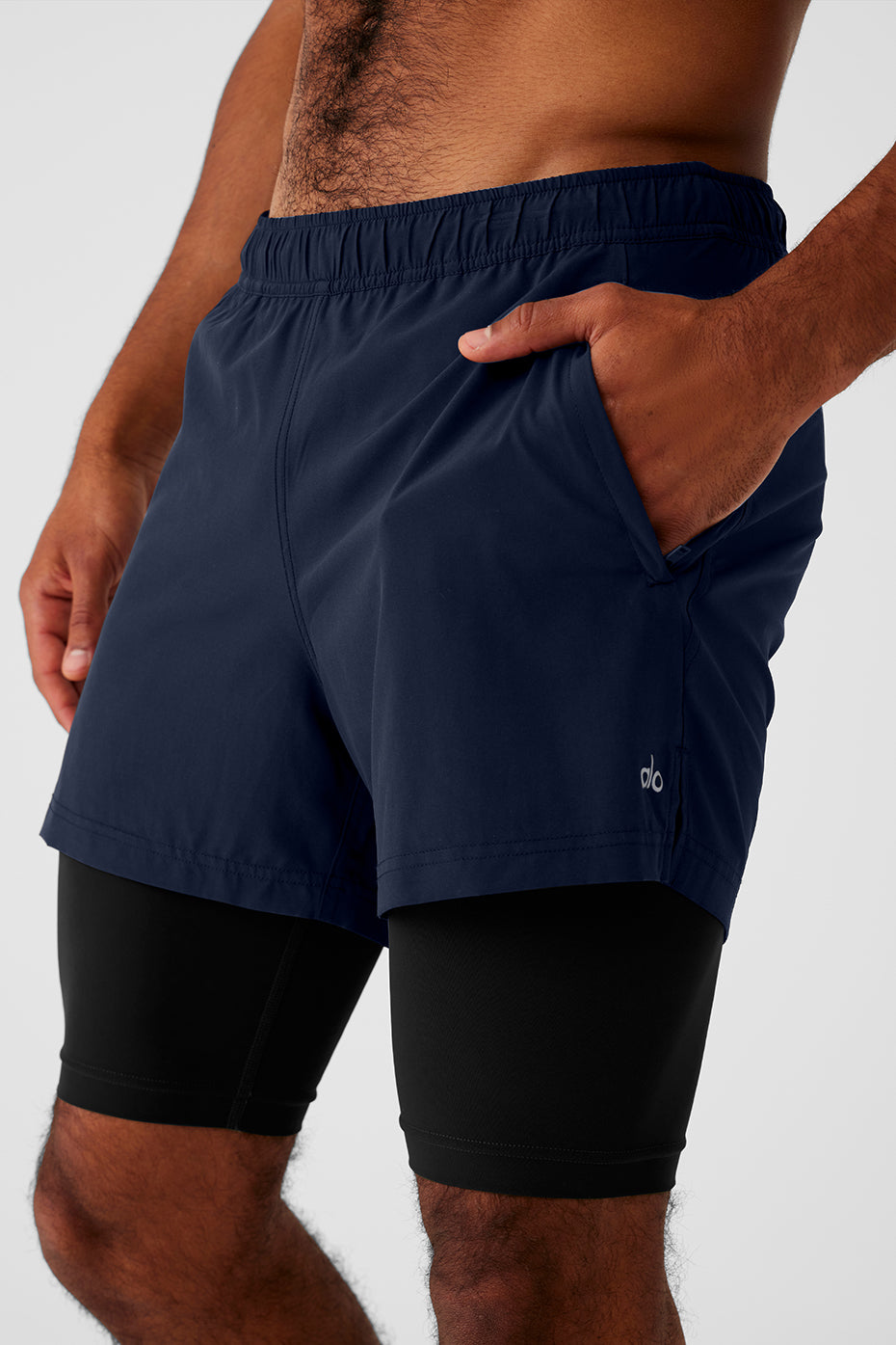 Front view of 2-in-1 shorts showing zip pocket and fitted waistband