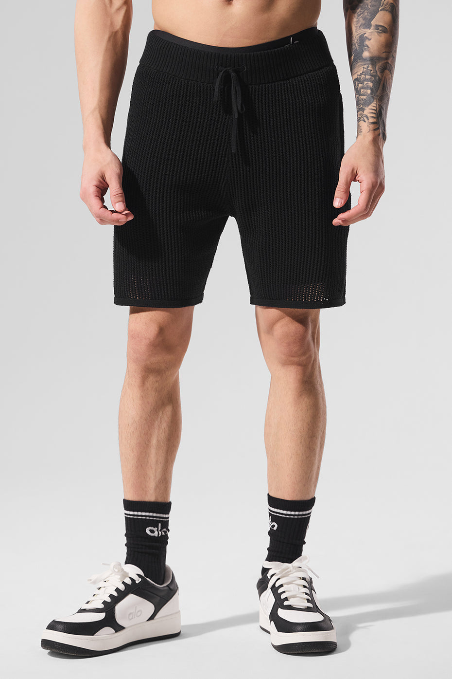 Back view of athletic shorts designed for water activities, featuring zippered pockets.