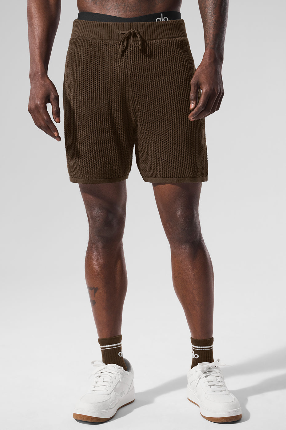 Side view of men's lightweight shorts with open-knit texture and espresso color