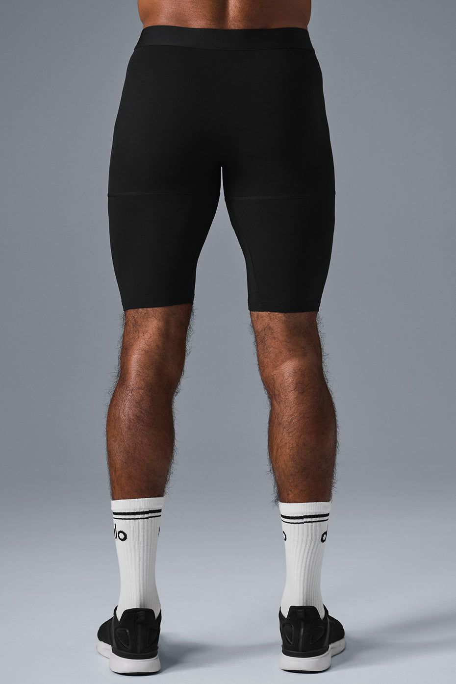 Close-up of moisture-wicking fabric and elastic waistband on running shorts