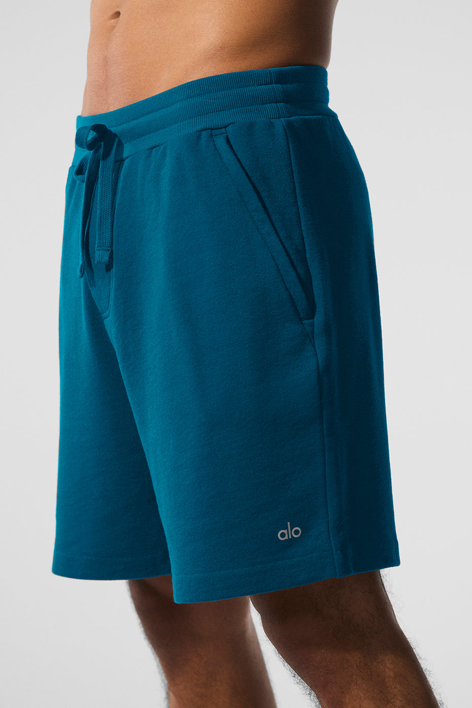 Close-up of the drawstring and side zipper pockets on Eclipse Blue lounge shorts.