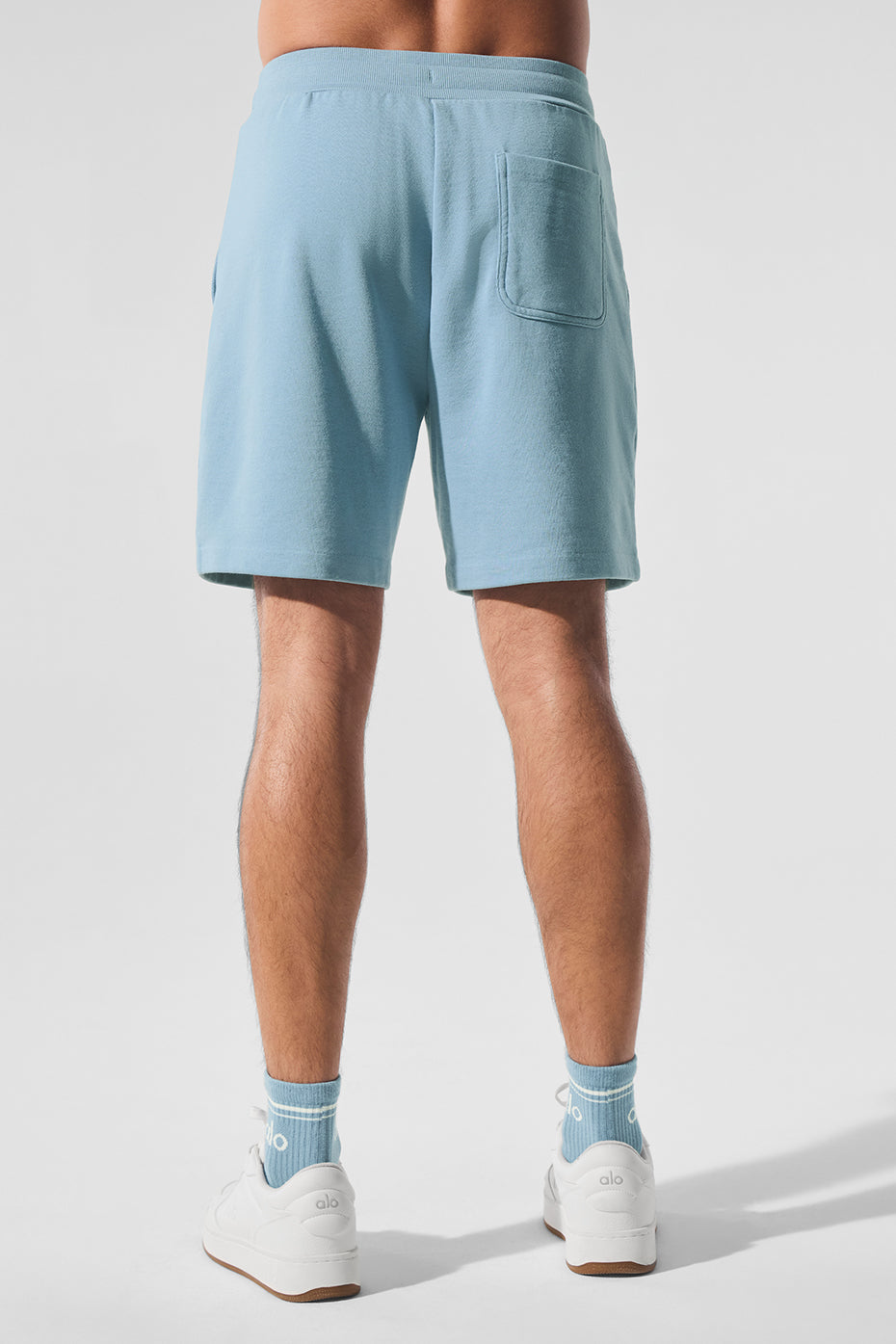 Lifestyle shot of men wearing comfortable French terry shorts at home