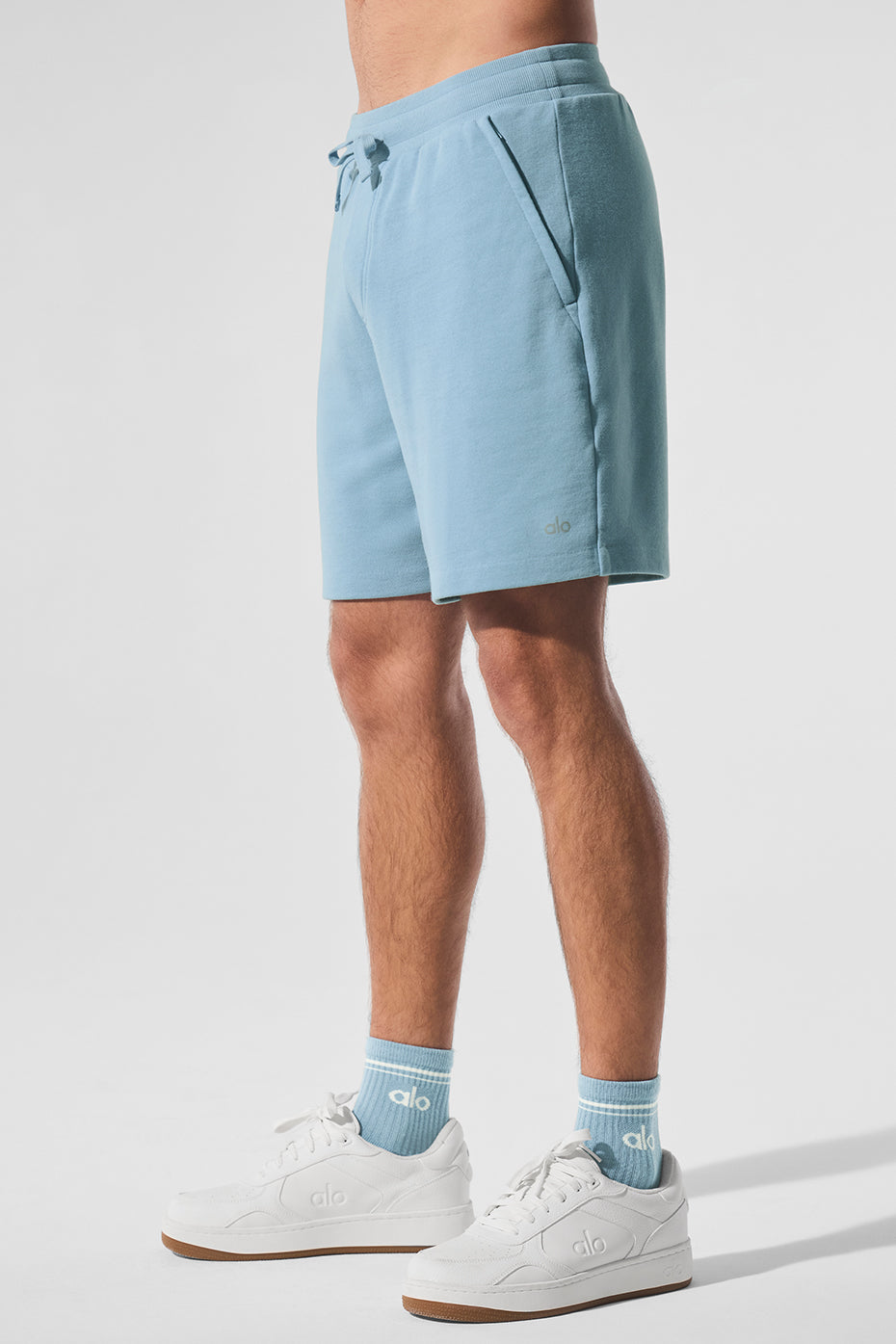 Back view highlighting the rear pocket and relaxed fit of French terry shorts