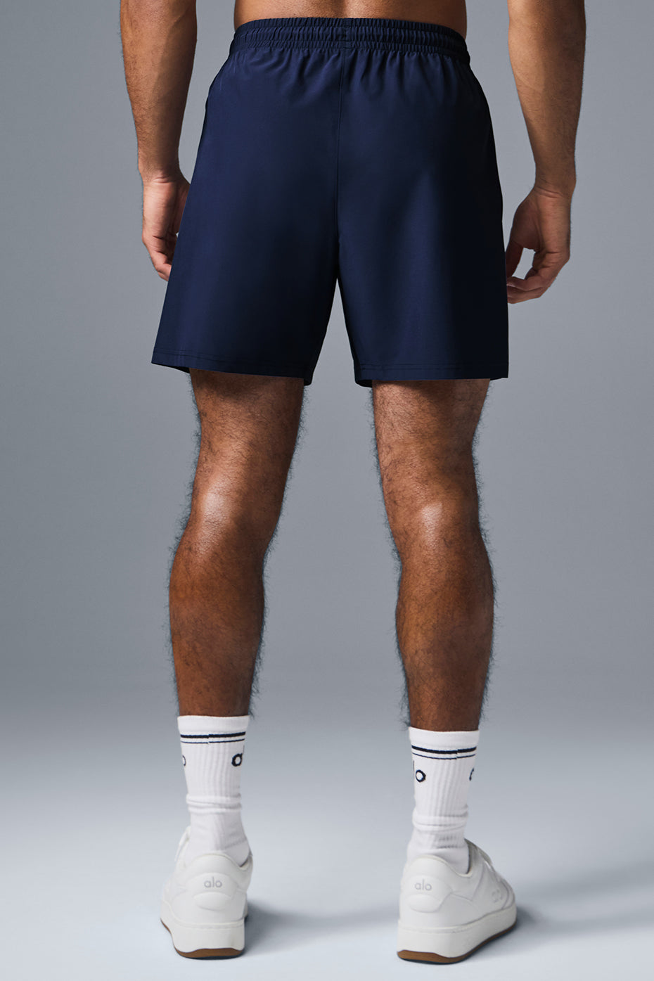 Side view showcasing the deep zippered pockets of the gym shorts.