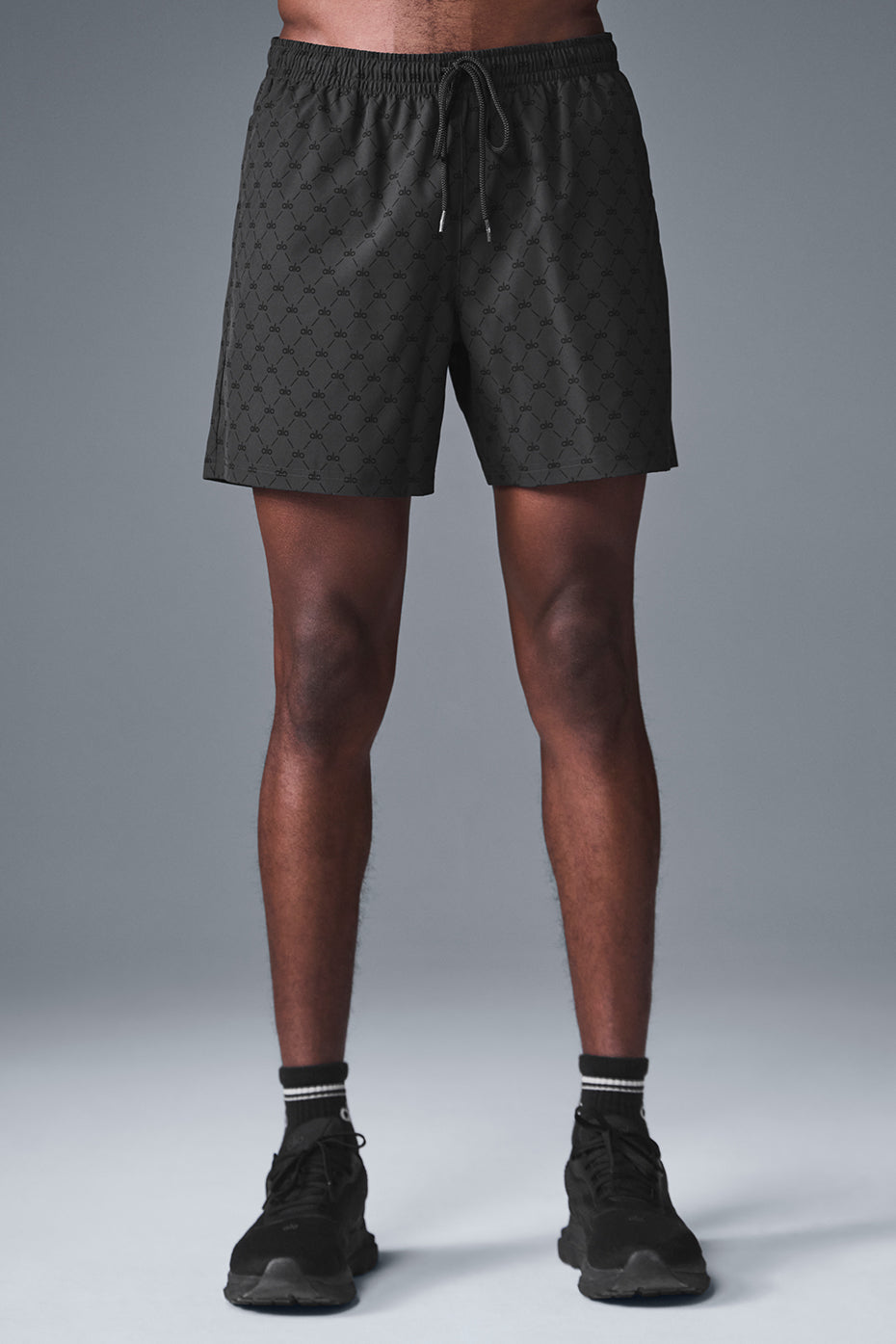 Close-up of black anthracite fitness shorts with drawcord waist and side zipper pocket