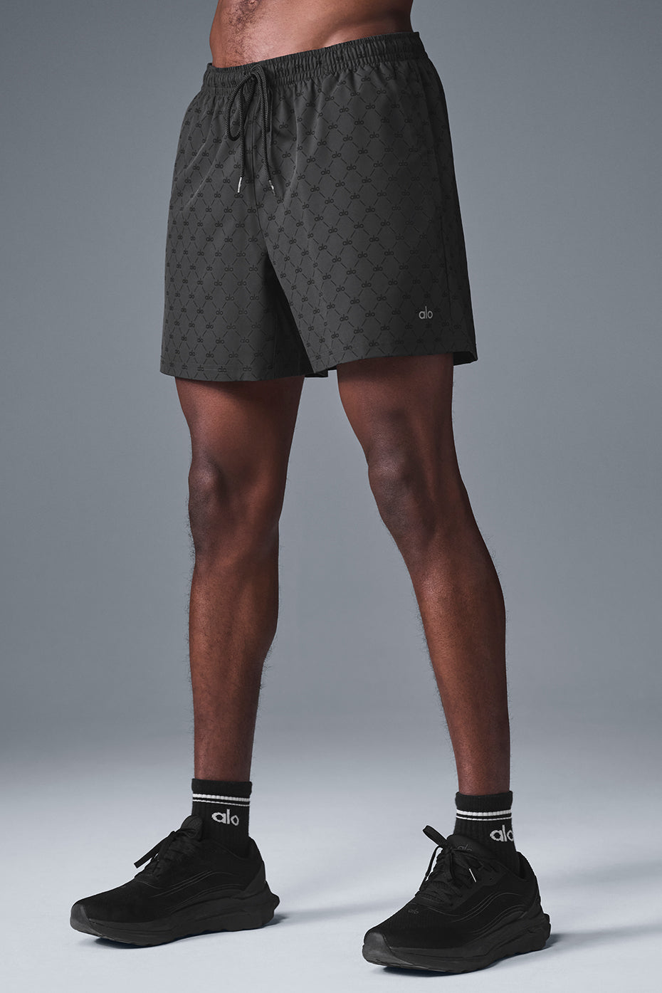 Close-up of black anthracite fitness shorts with drawcord waist and side zipper pocket