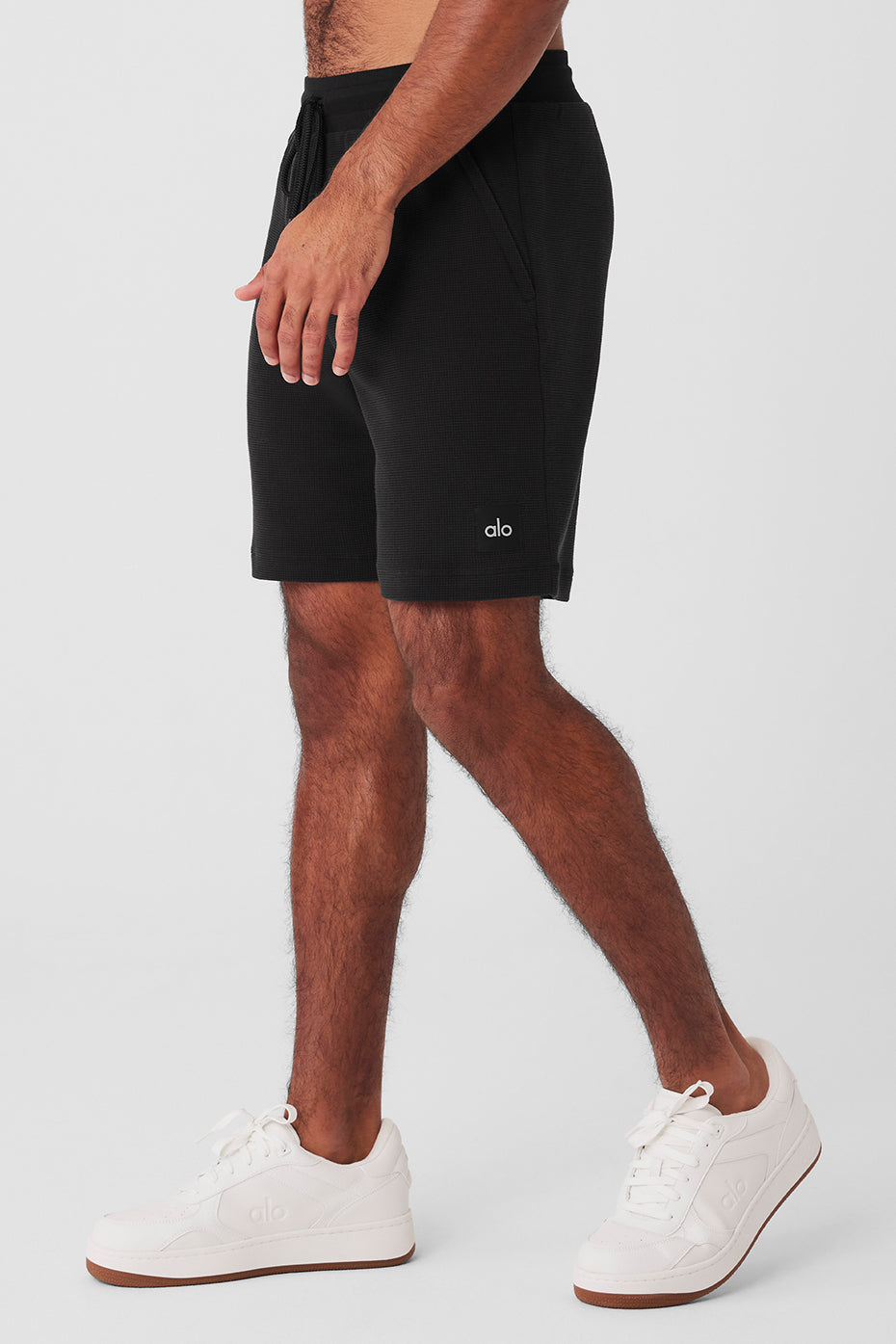 Front view of mens waffle shorts highlighting the zippered pockets and drawstring waist