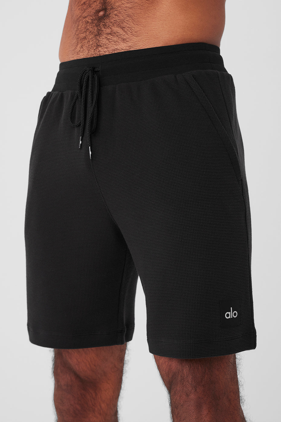 Close-up of mens micro waffle shorts showing the textured fabric and 7-inch inseam