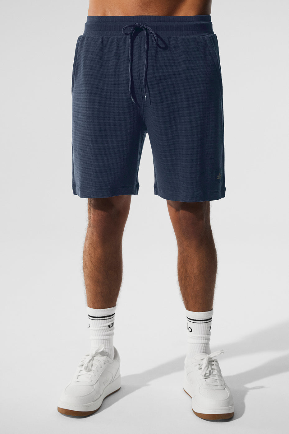Side view of navy men's lounge shorts showcasing the drawstring waist.