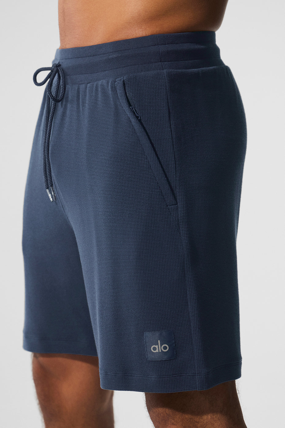 Model wearing navy micro waffle shorts paired with a matching shirt.