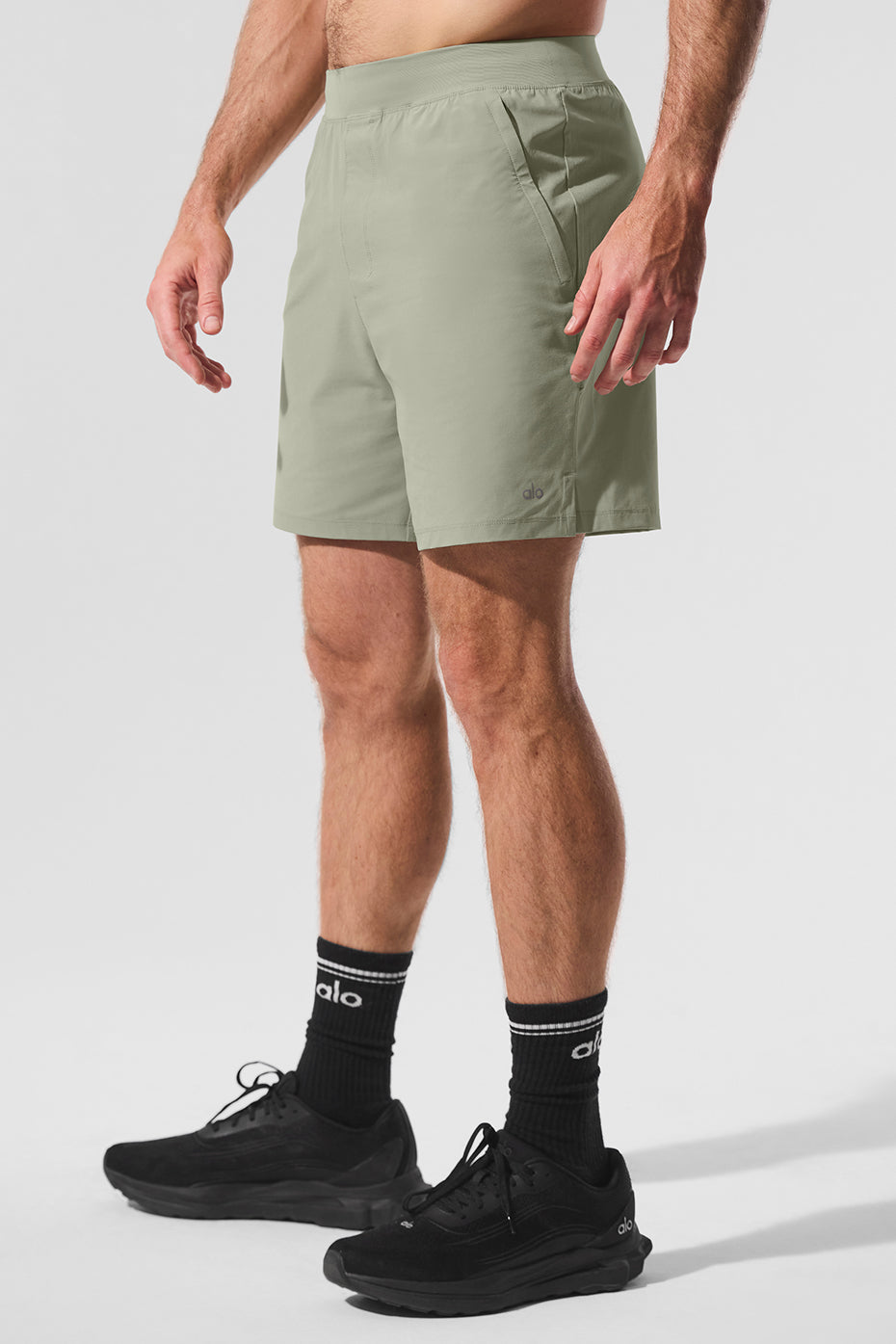 Side view of Limestone performance shorts, showcasing the elastic waistband and pockets.