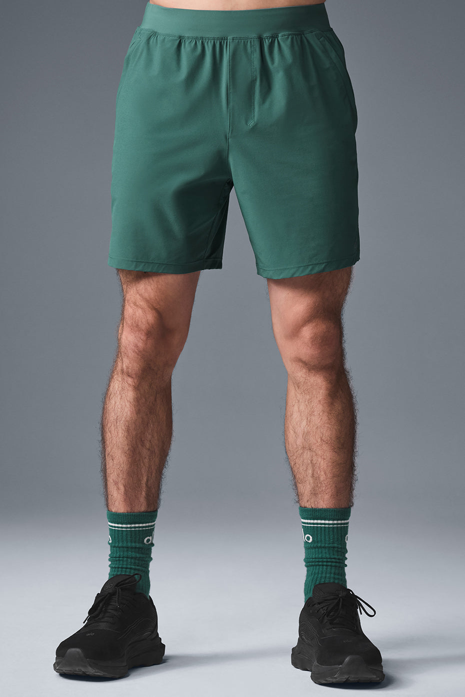 Close-up of moisture-wicking shorts waistband and zip pocket for secure activewear storage
