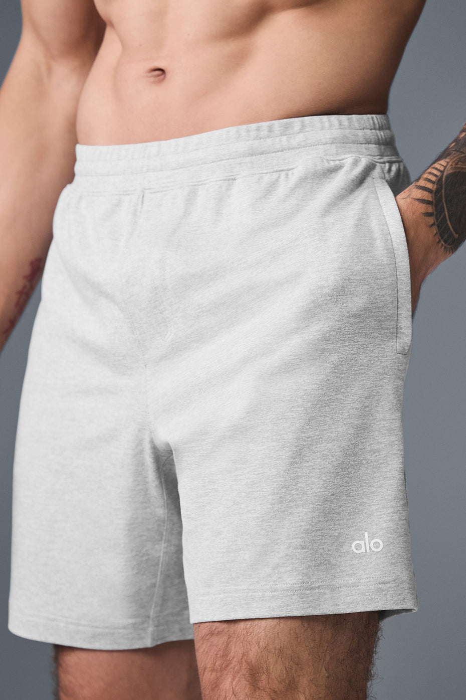 Front view of mens workout shorts in heather grey, showing streamlined fit