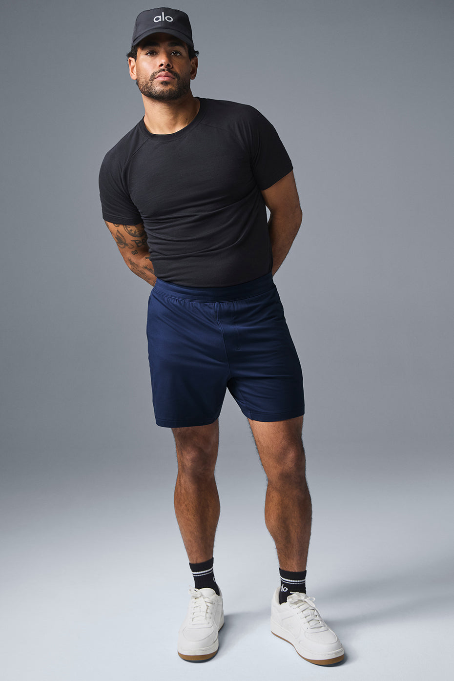 Men's navy lightweight workout shorts in action during outdoor training