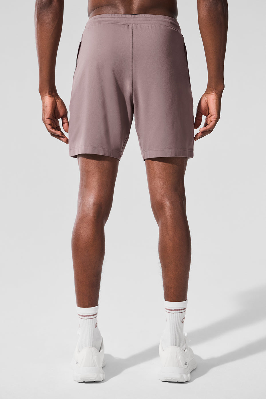 Side view of mens performance shorts, highlighting the internal drawcord feature.