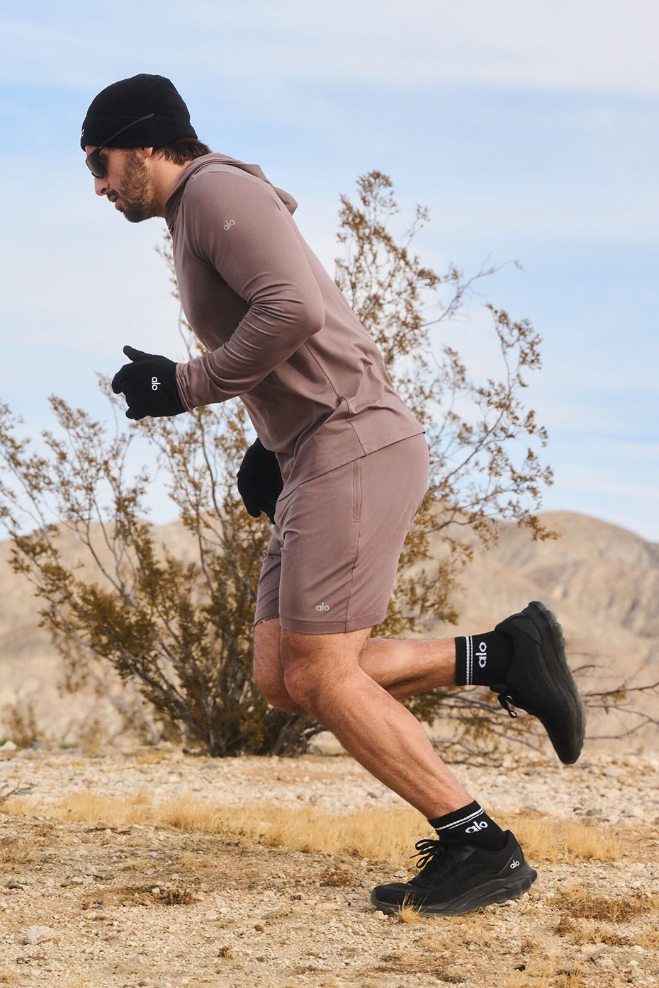 Side view of mens performance shorts, highlighting the internal drawcord feature.