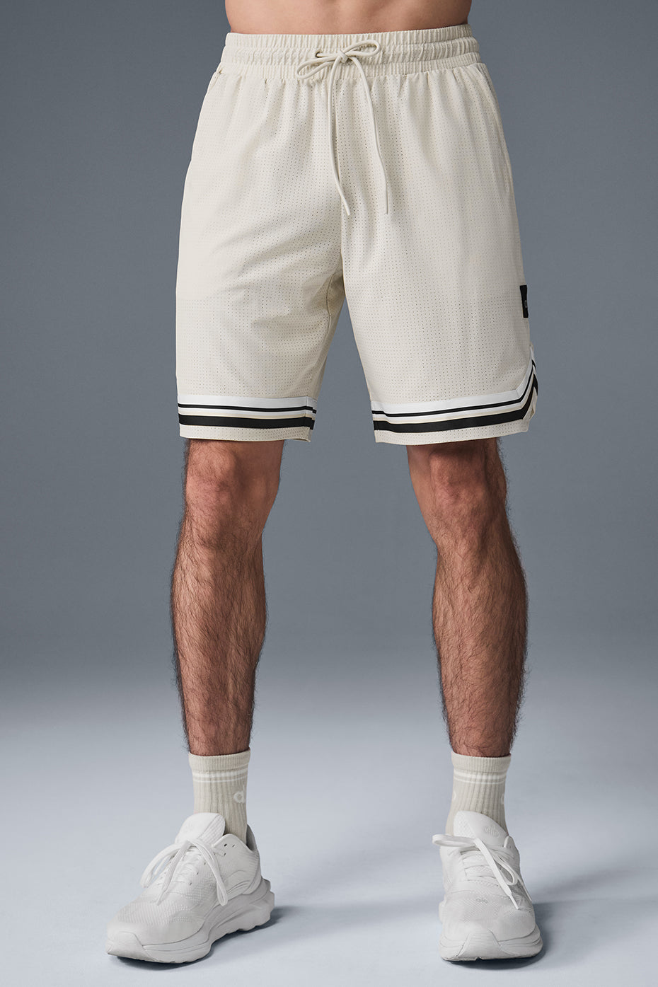 Front view of Traction Arena 9-inch performance shorts, showcasing breathable fabric.