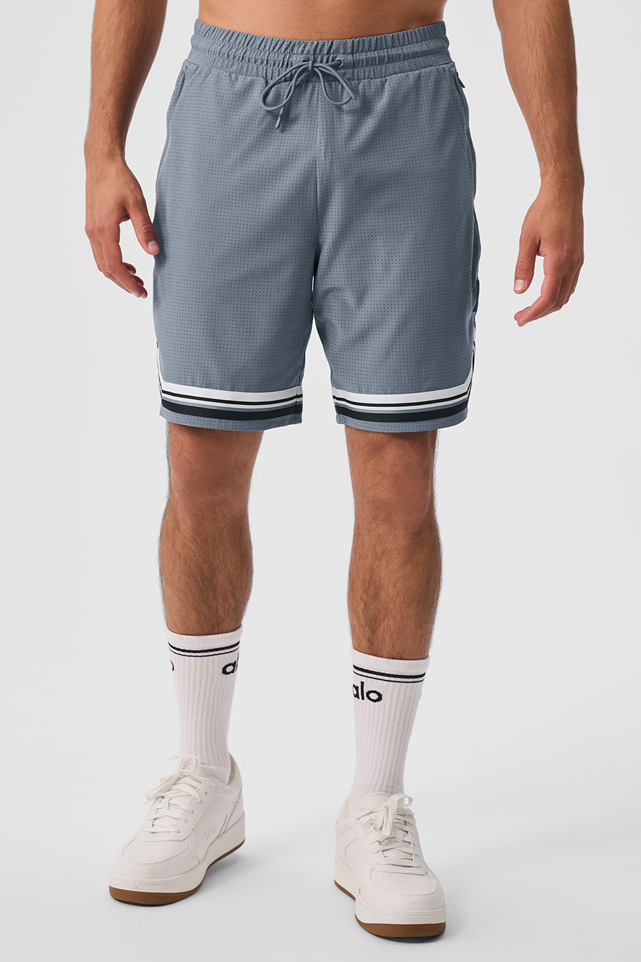 Side view of women's performance shorts with perforated breathable fabric