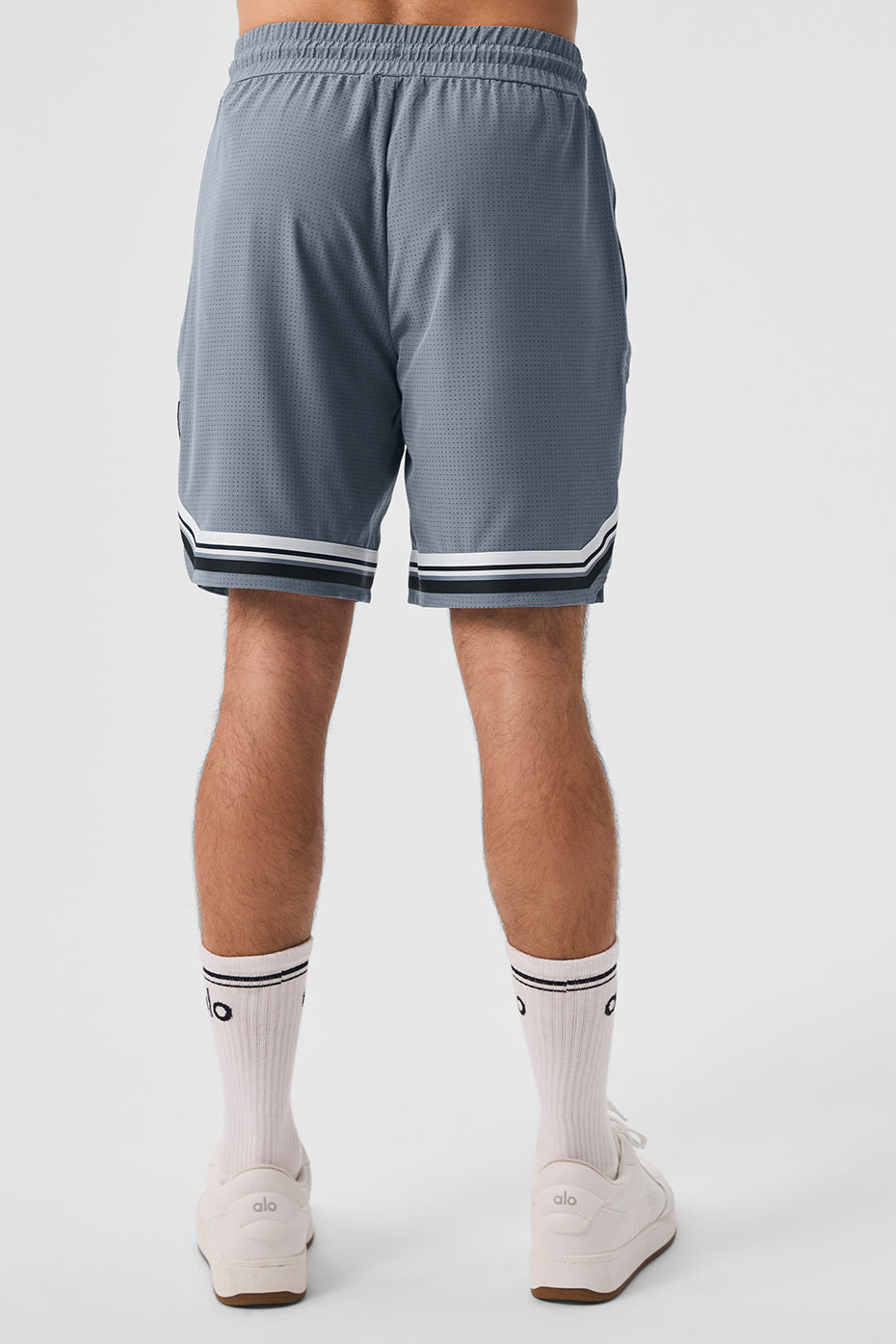 Front of stylish womens workout shorts with zip pockets and varsity hem detail