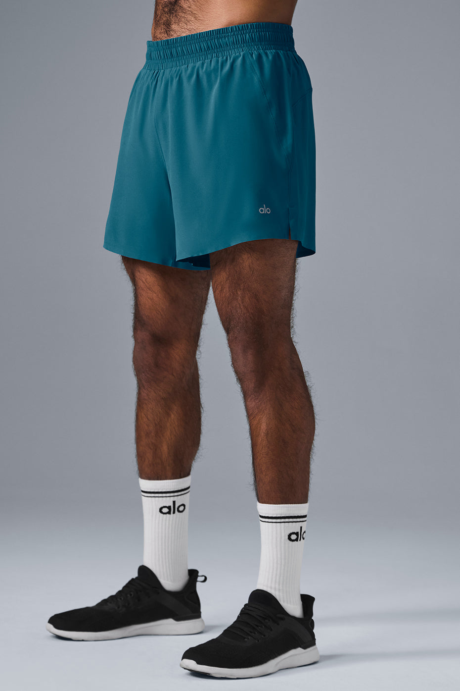 Close-up of the elastic waistband and drawcords of the mens running shorts.