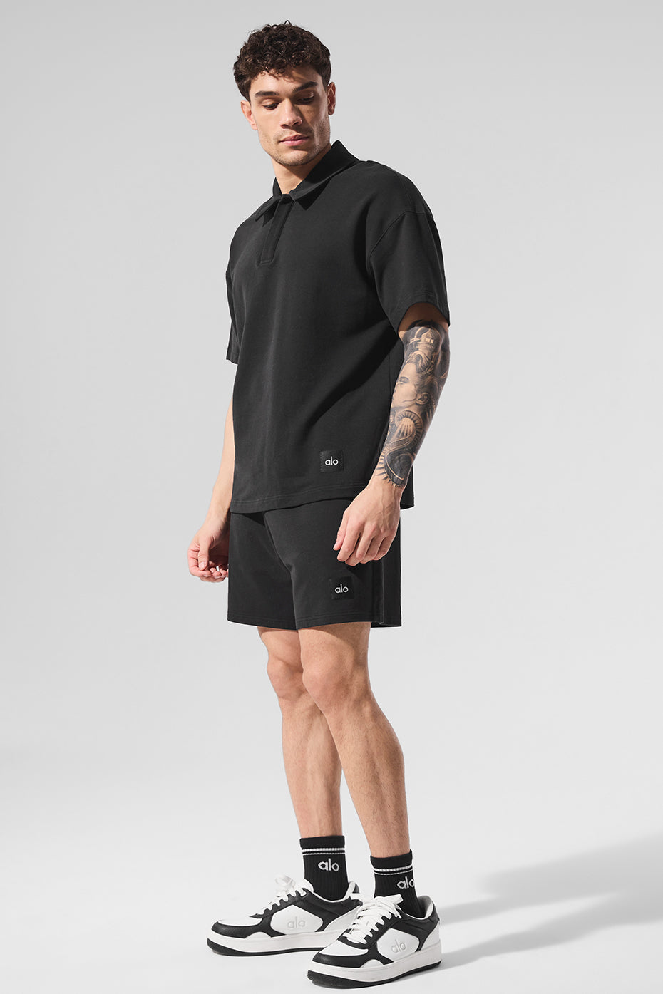 Jet black shorts paired with white sneakers, ideal for relaxed mornings in Sacramento neighborhoods.