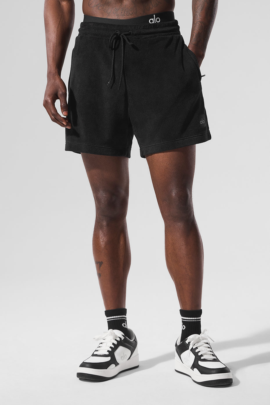 Styled shot of mens coastal terry shorts paired with matching button-up shirt for summer style