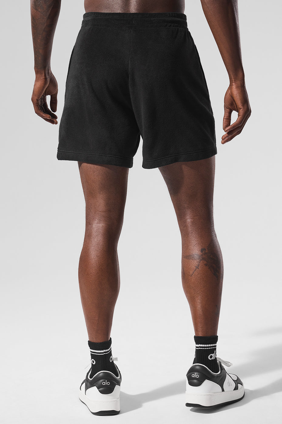 Mens 7-inch terry shorts in black with zippered pockets, perfect for summer casual wear
