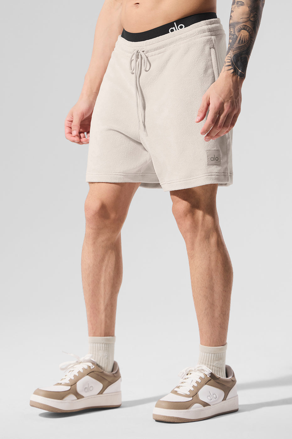 Front view of men's coastal terry shorts with zippered pockets and 7-inch hem