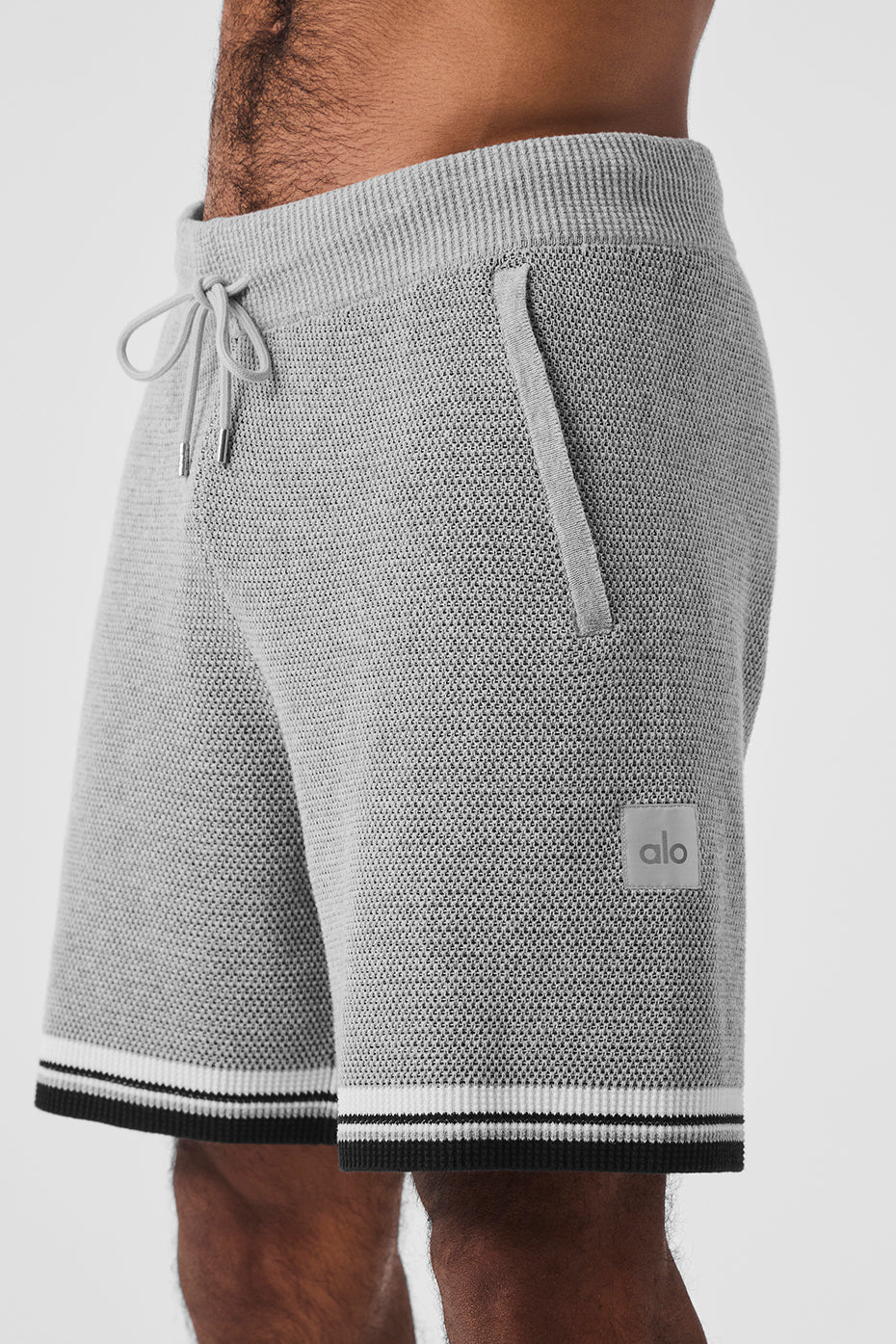Side view showcasing the relaxed fit and pockets of the basketball shorts.