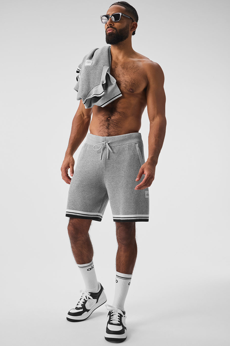 Side view showcasing the relaxed fit and pockets of the basketball shorts.