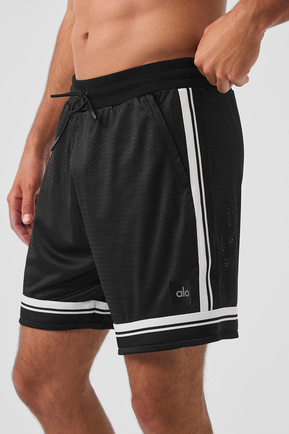 Side angle of basketball mesh shorts highlighting the contrasting trim and relaxed fit.