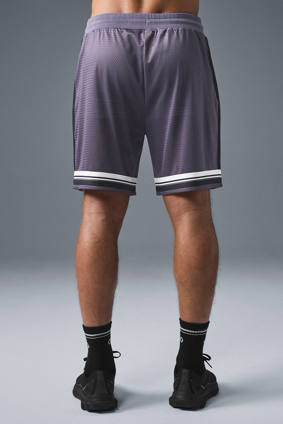 Side view of breathable basketball mesh shorts with drawstring for a comfortable fit.