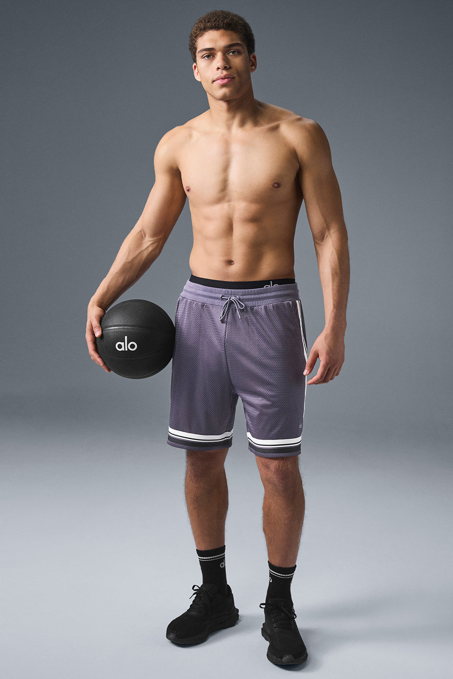 Side view of breathable basketball mesh shorts with drawstring for a comfortable fit.