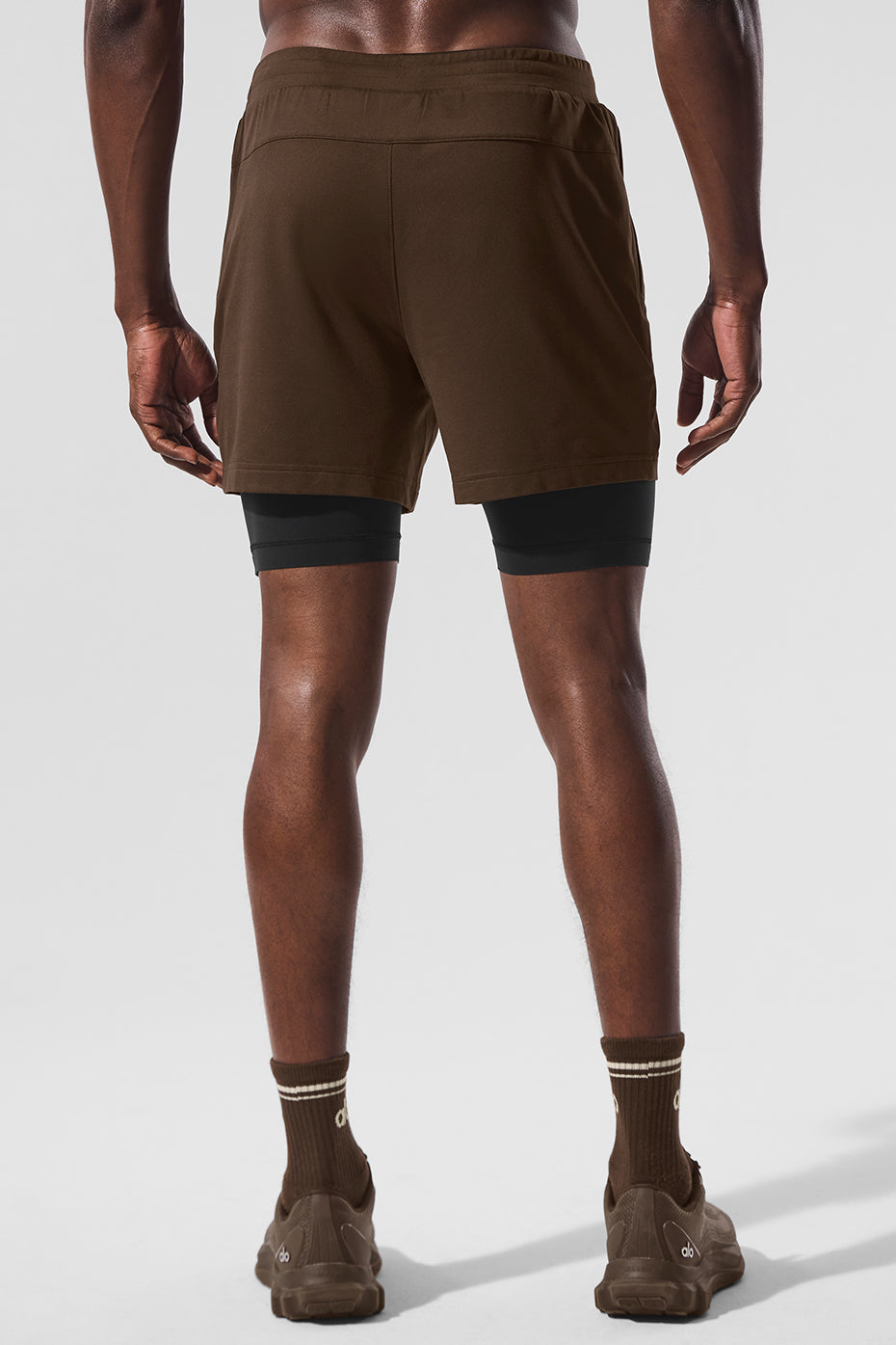 Stylish mens 2-in-1 training shorts in espresso and black for athletic use