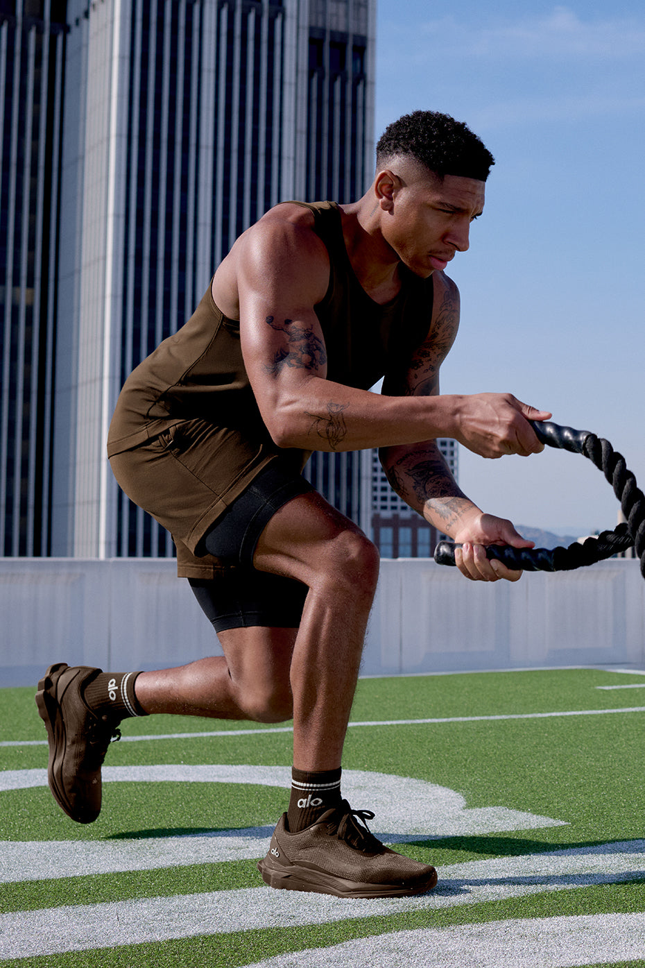 Stylish mens 2-in-1 training shorts in espresso and black for athletic use