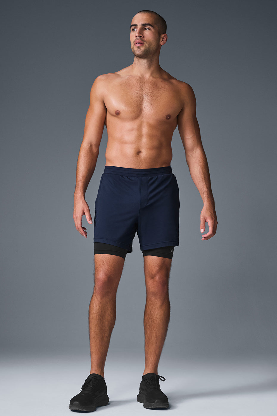 Close-up of the fabric and design details of Conquer performance shorts.