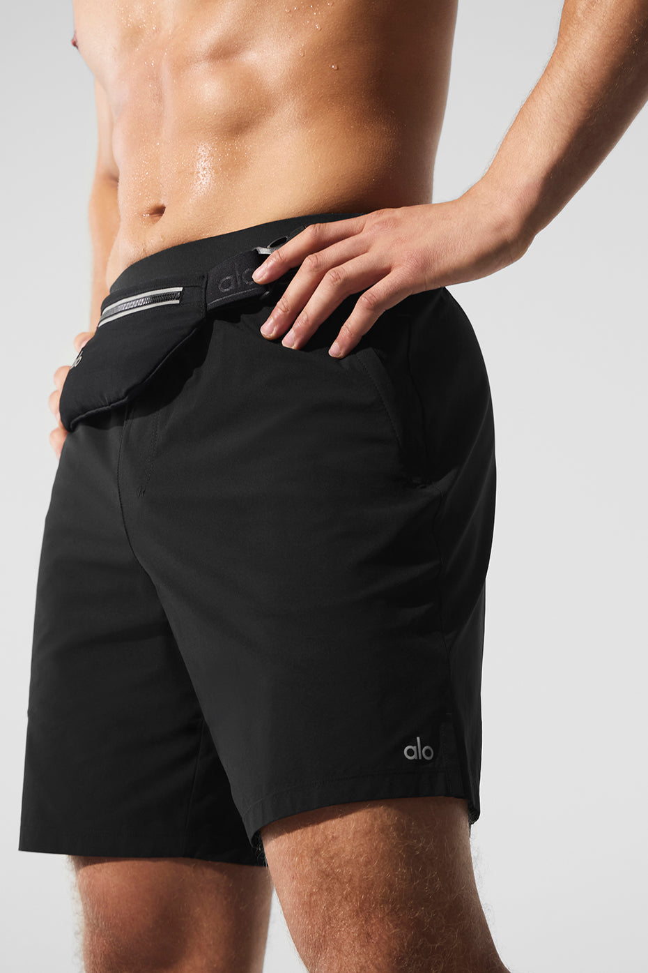 Back view highlighting the elastic waistband of the athletic shorts.