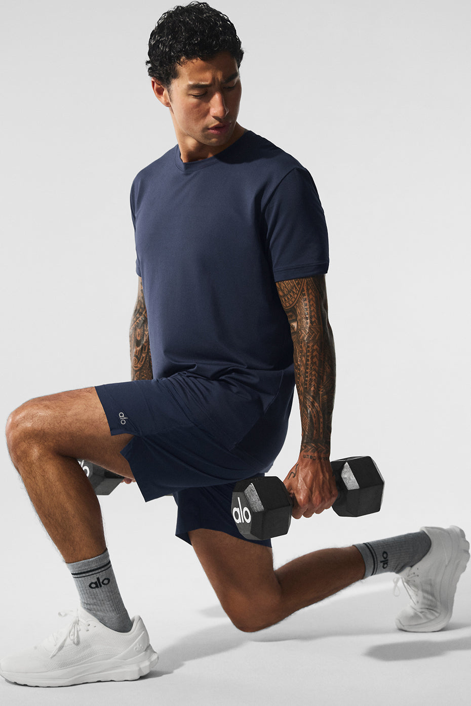 Navy performance shorts showcasing moisture-wicking fabric and elastic waistband.
