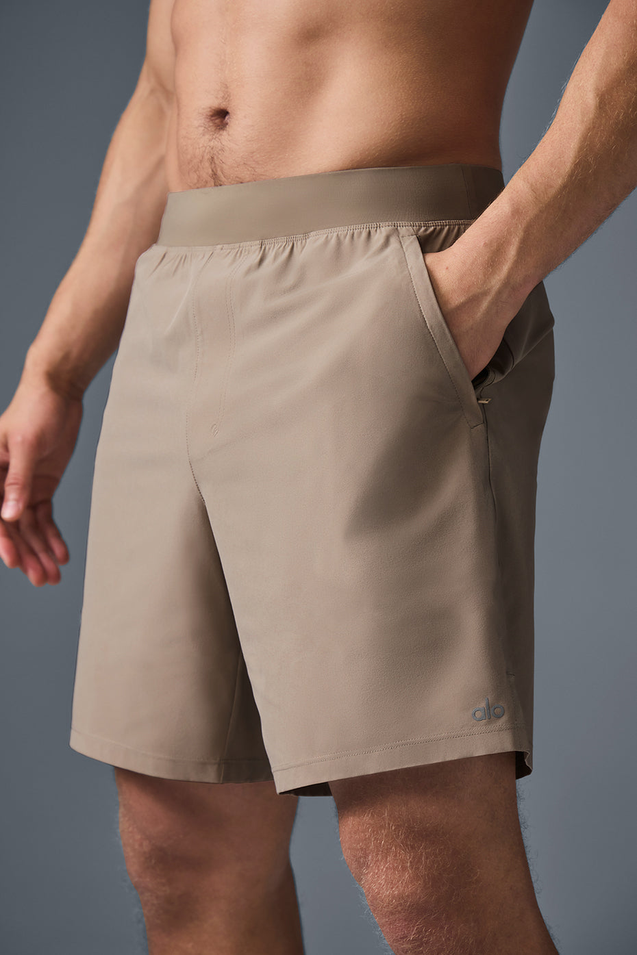 Close-up of elastic waistband and internal drawcords on performance shorts.