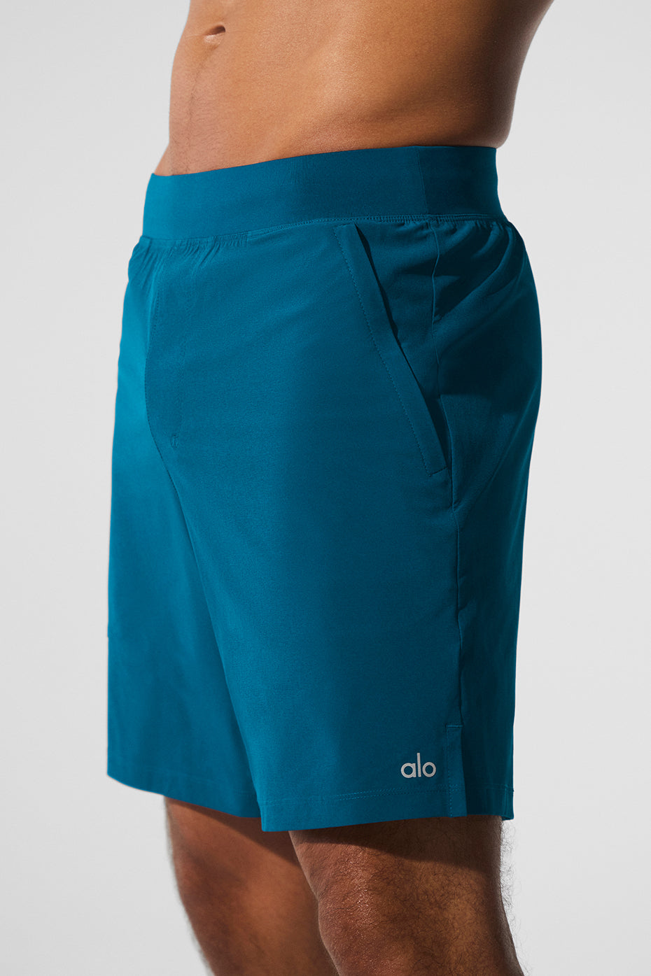Front view of Eclipse Blue performance shorts showcasing zip pockets.