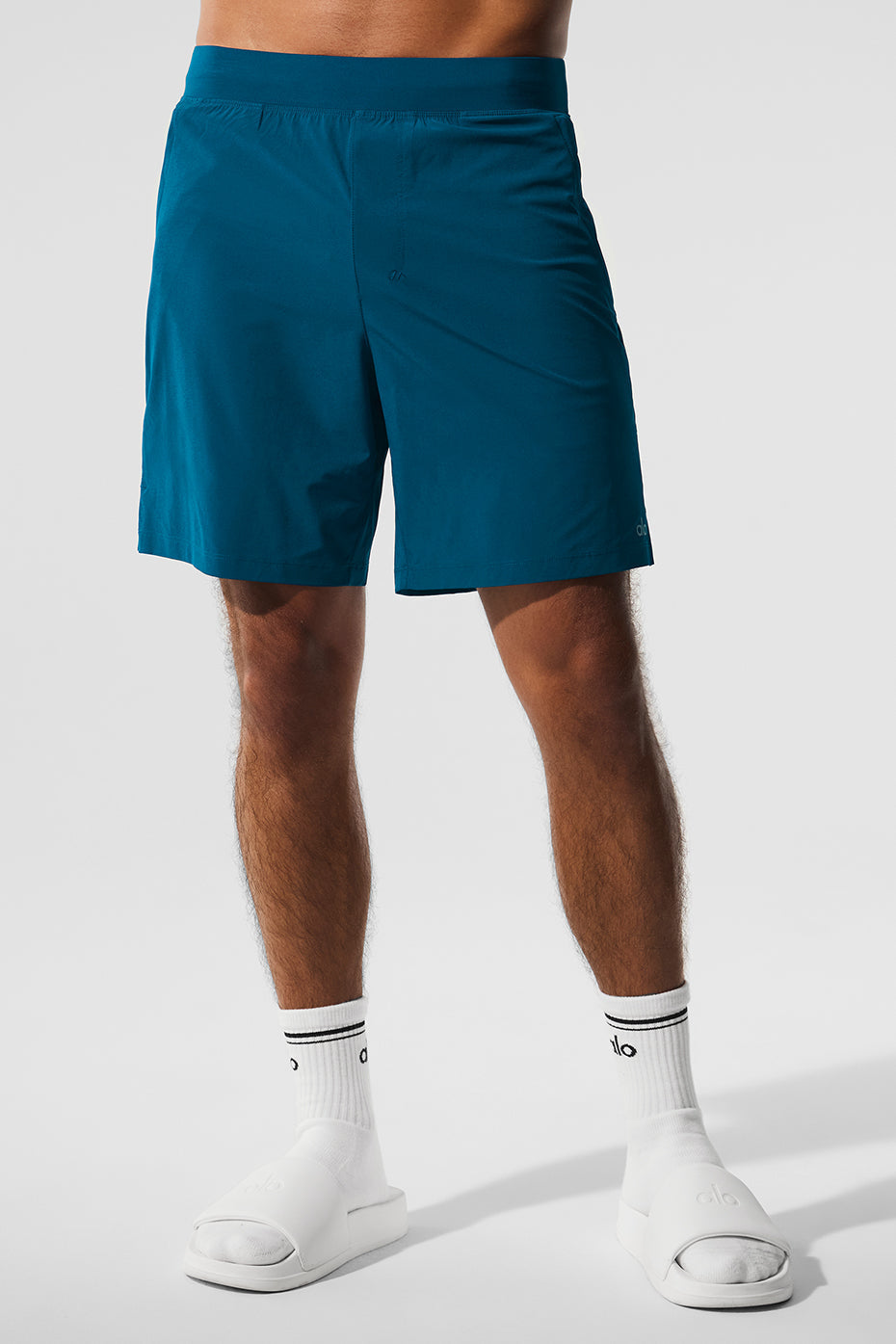 Front view of Eclipse Blue performance shorts showcasing zip pockets.
