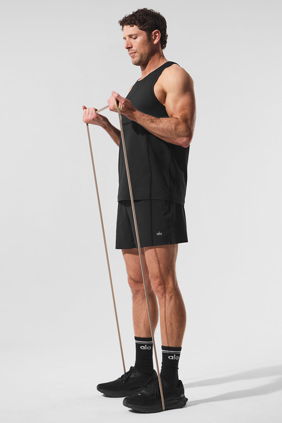 Front view of 5-inch black running shorts, showcasing the elastic waistband.