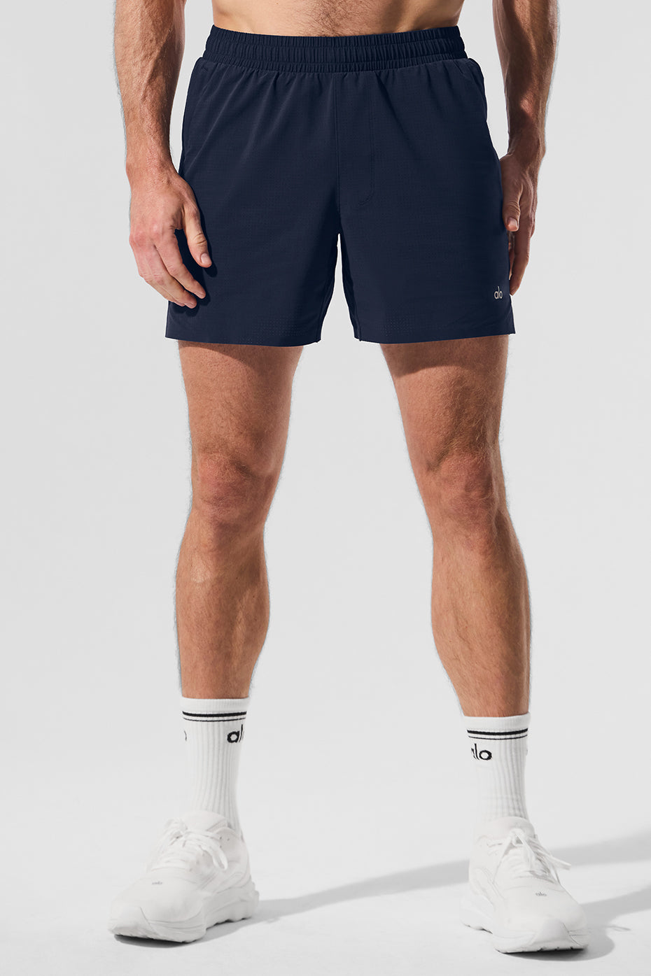 Front view of navy 5-inch traction running shorts for men, showcasing breathable fabric.