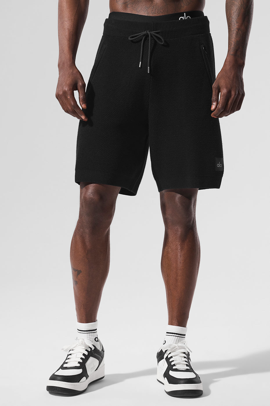 Front view of Elite Sports Club Knit Shorts in black, ideal for summer wear.
