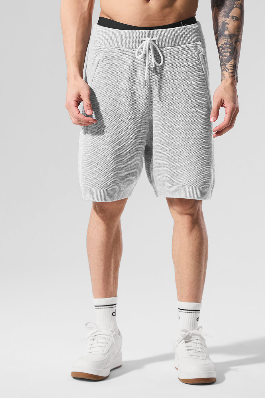Close-up of the textured knit fabric on men's athletic shorts.